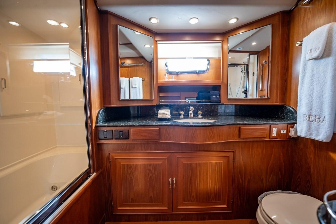 a bathroom with a sink and cabinets aboard BEBA Yacht for Sale