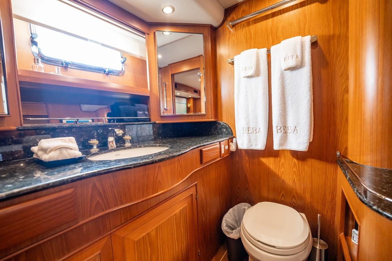 a bathroom with a sink and a mirror aboard BEBA Yacht for Sale