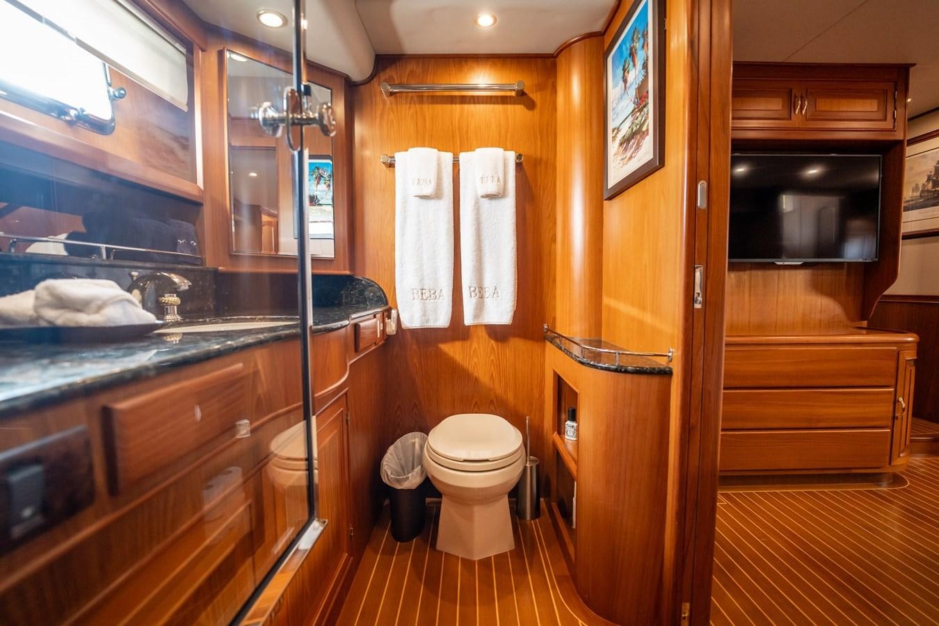 a bathroom with a glass shower aboard BEBA Yacht for Sale
