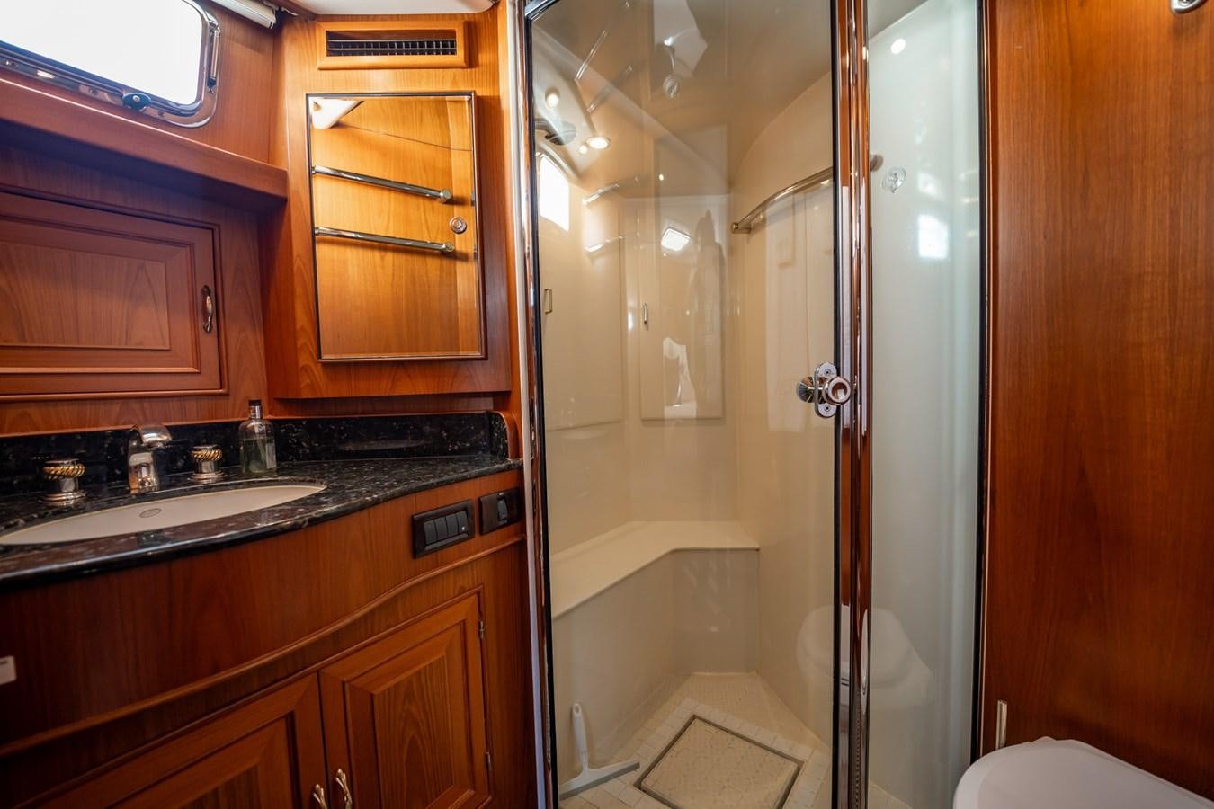 a bathroom with a glass shower aboard BEBA Yacht for Sale