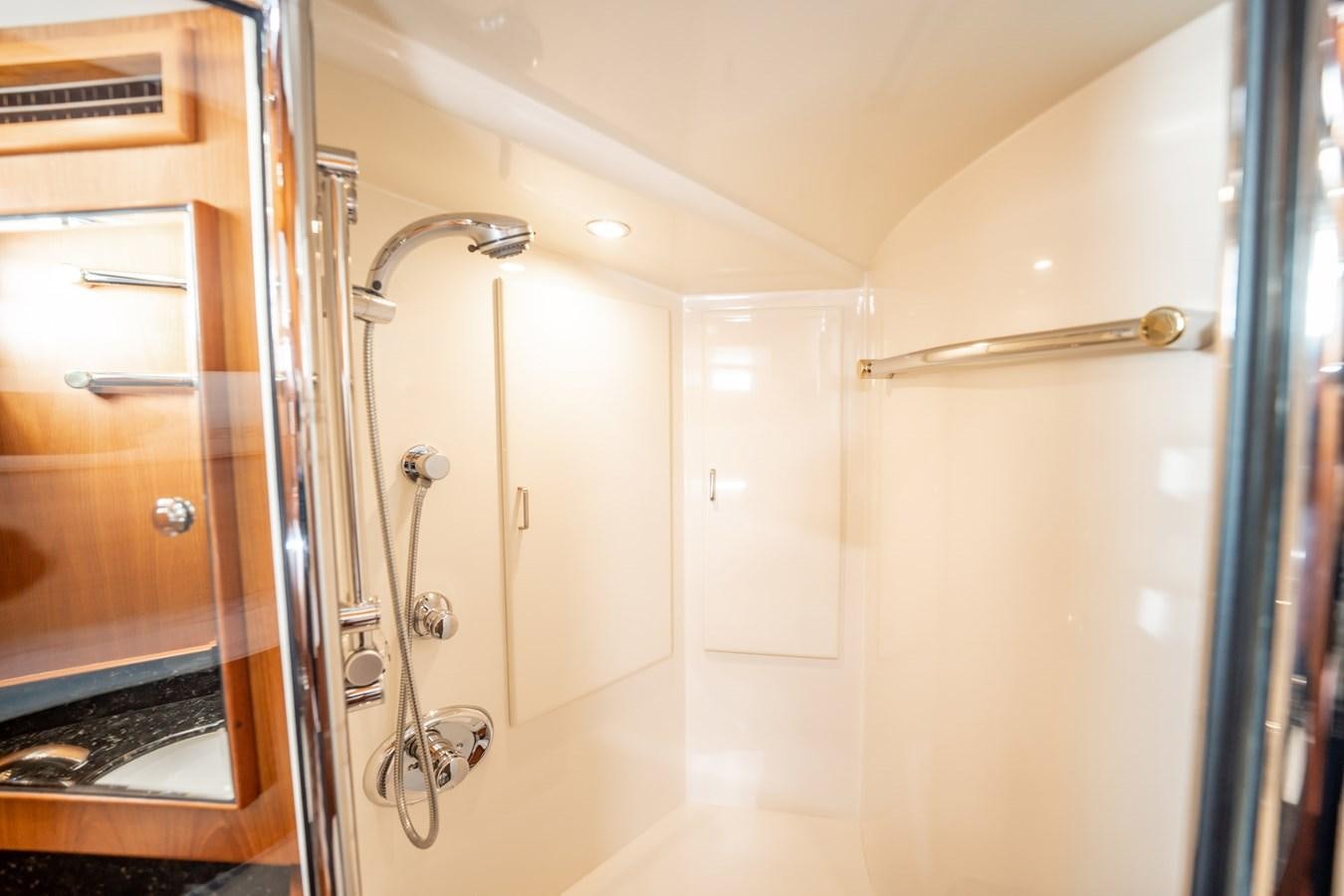 a bathroom with a shower unit and a sink aboard BEBA Yacht for Sale