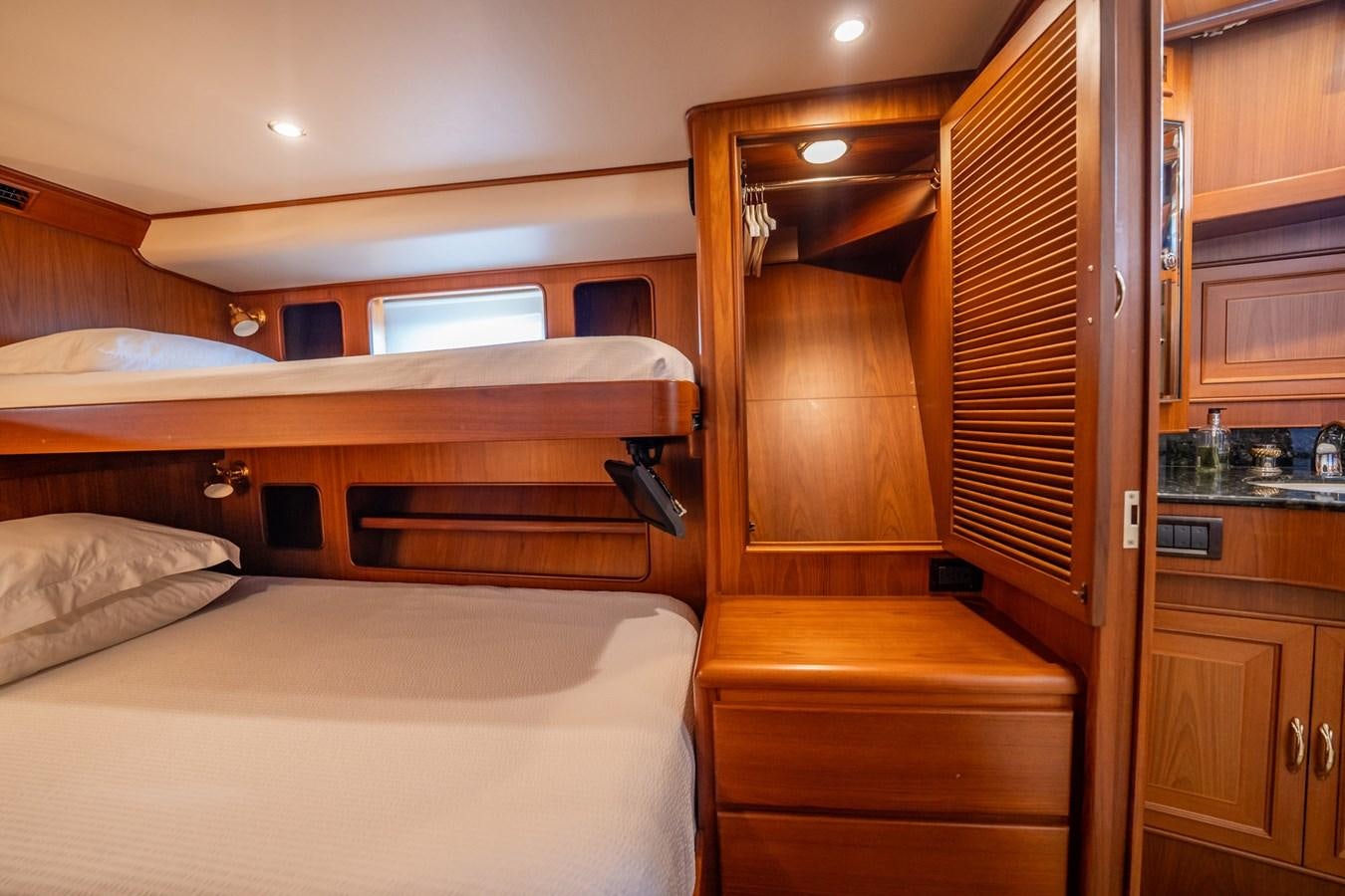 a room with a bed and a closet aboard BEBA Yacht for Sale