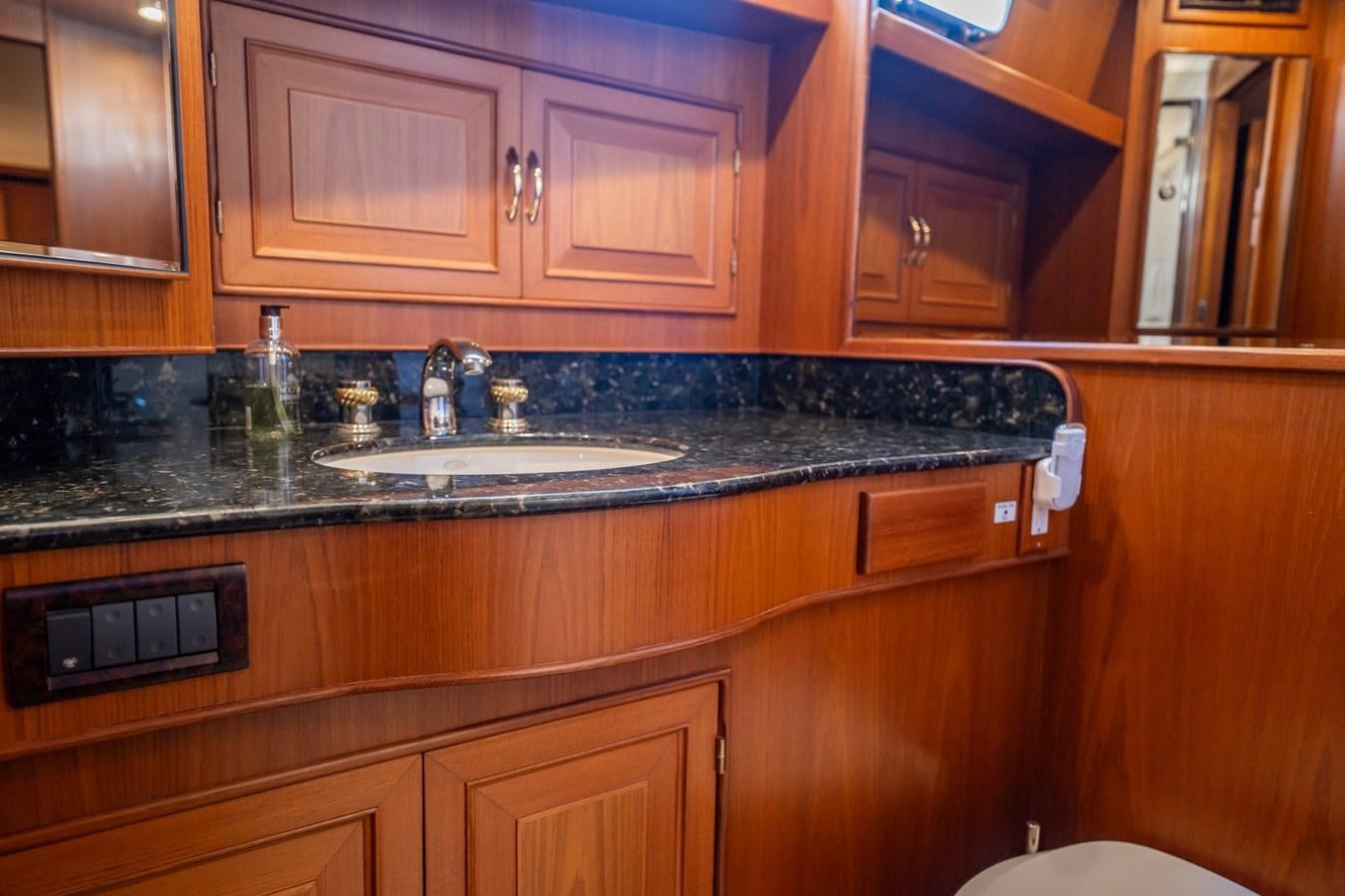 a kitchen with a black countertop aboard BEBA Yacht for Sale