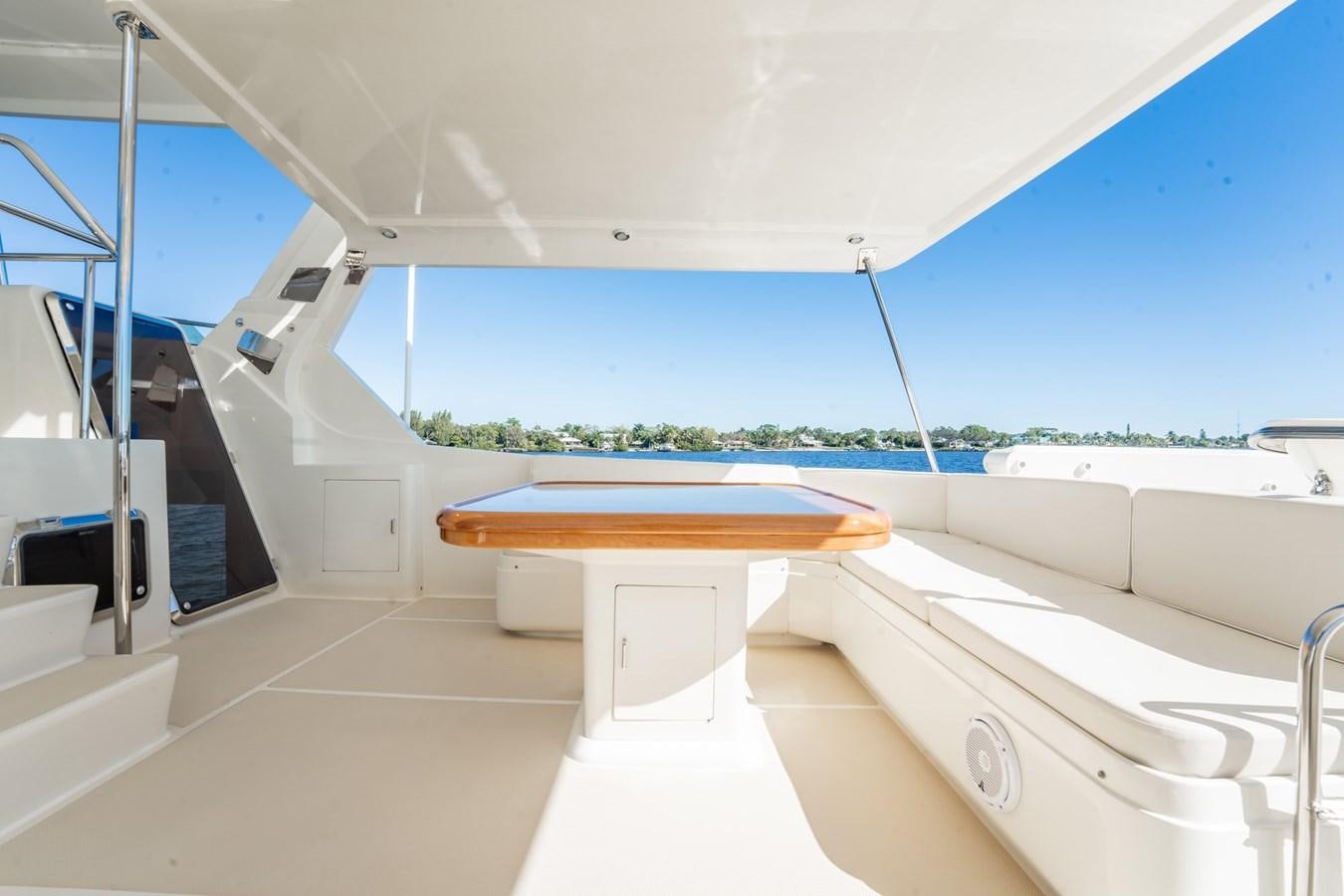 a room with a table and a bench aboard BEBA Yacht for Sale