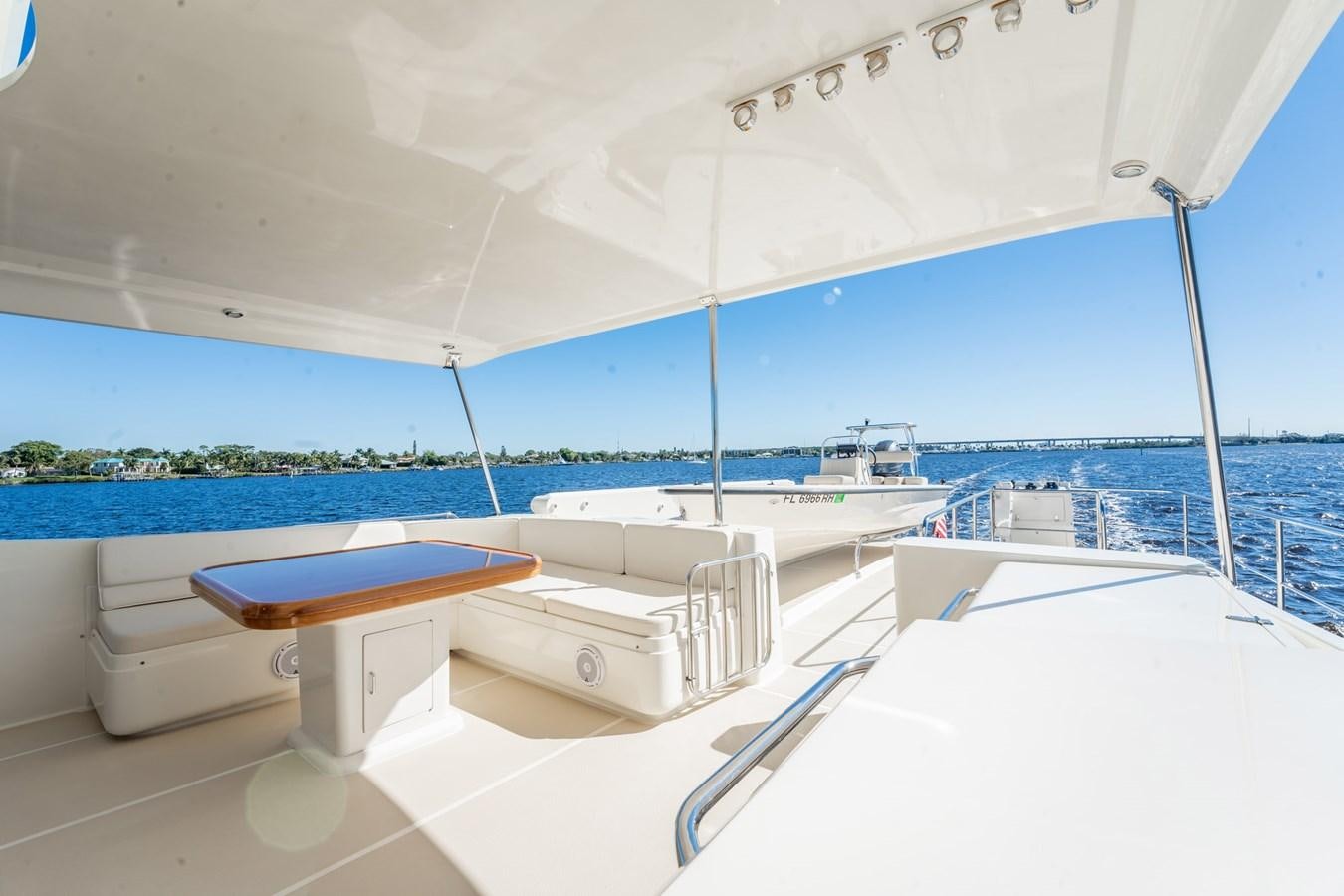 a white lounge chair on a white yacht aboard BEBA Yacht for Sale