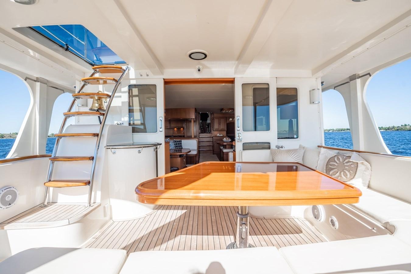 a room with a table and chairs aboard BEBA Yacht for Sale