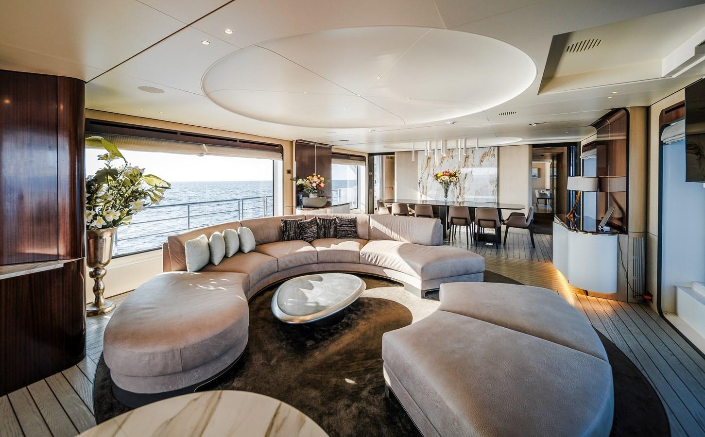 a living room with a large window aboard IRYNA Yacht for Sale
