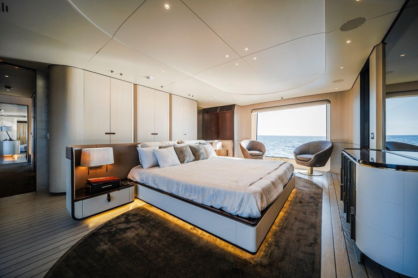 a large bedroom with a bed aboard IRYNA Yacht for Sale