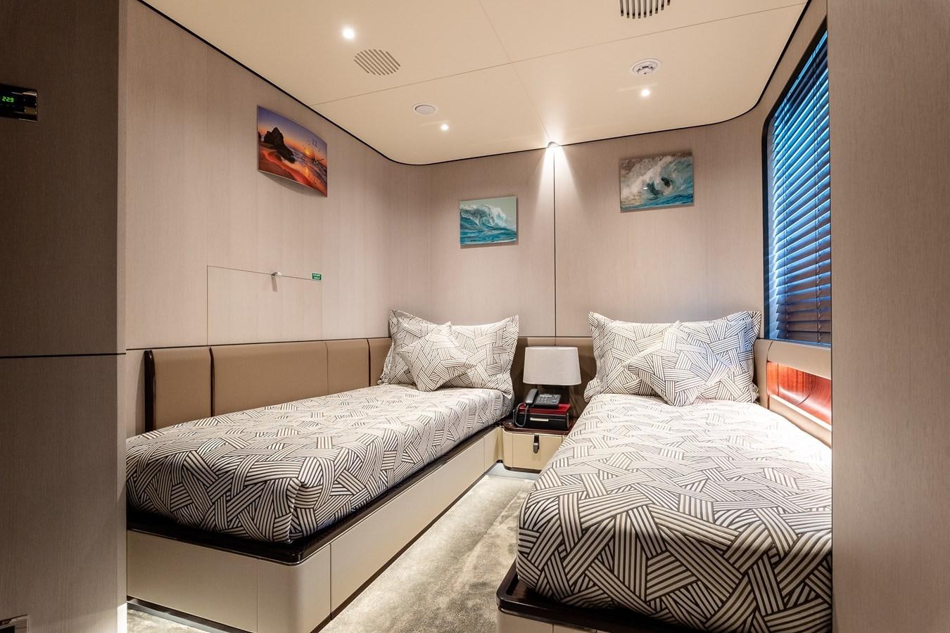 a couple of beds in a hotel room aboard IRYNA Yacht for Sale