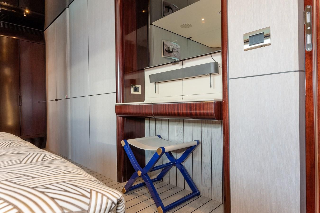 a room with a bed and a table aboard IRYNA Yacht for Sale