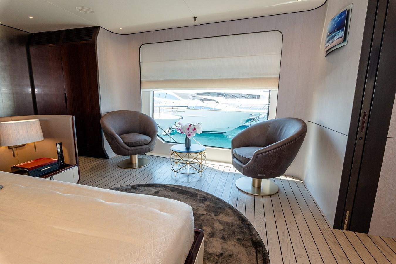 a living room with a large window aboard IRYNA Yacht for Sale