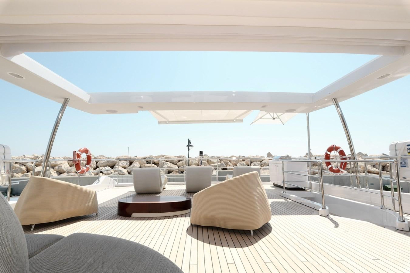 a large white tent with chairs and a table on it aboard IRYNA Yacht for Sale