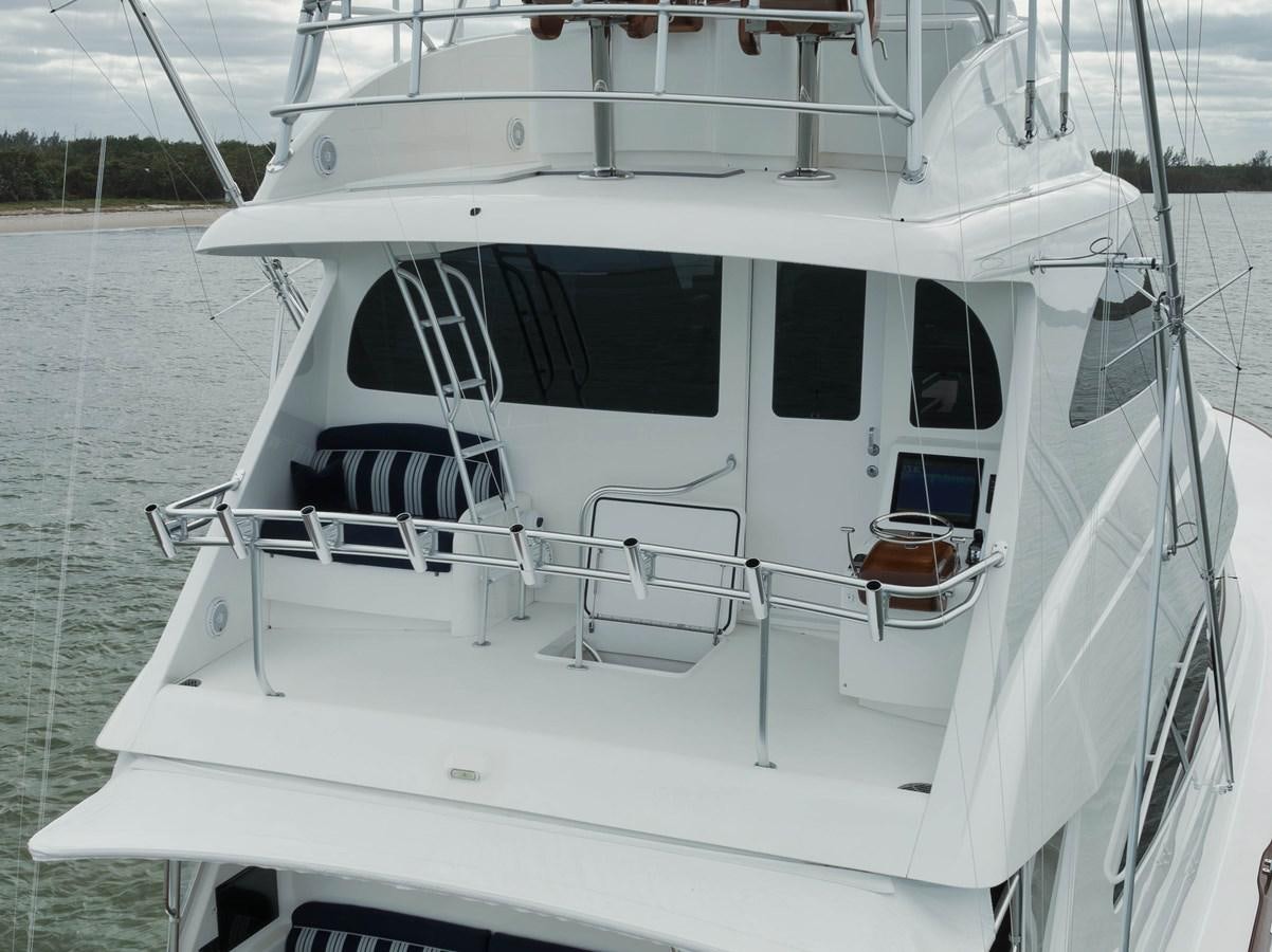 a white boat on the water aboard COOKIE MONSTER Yacht for Sale