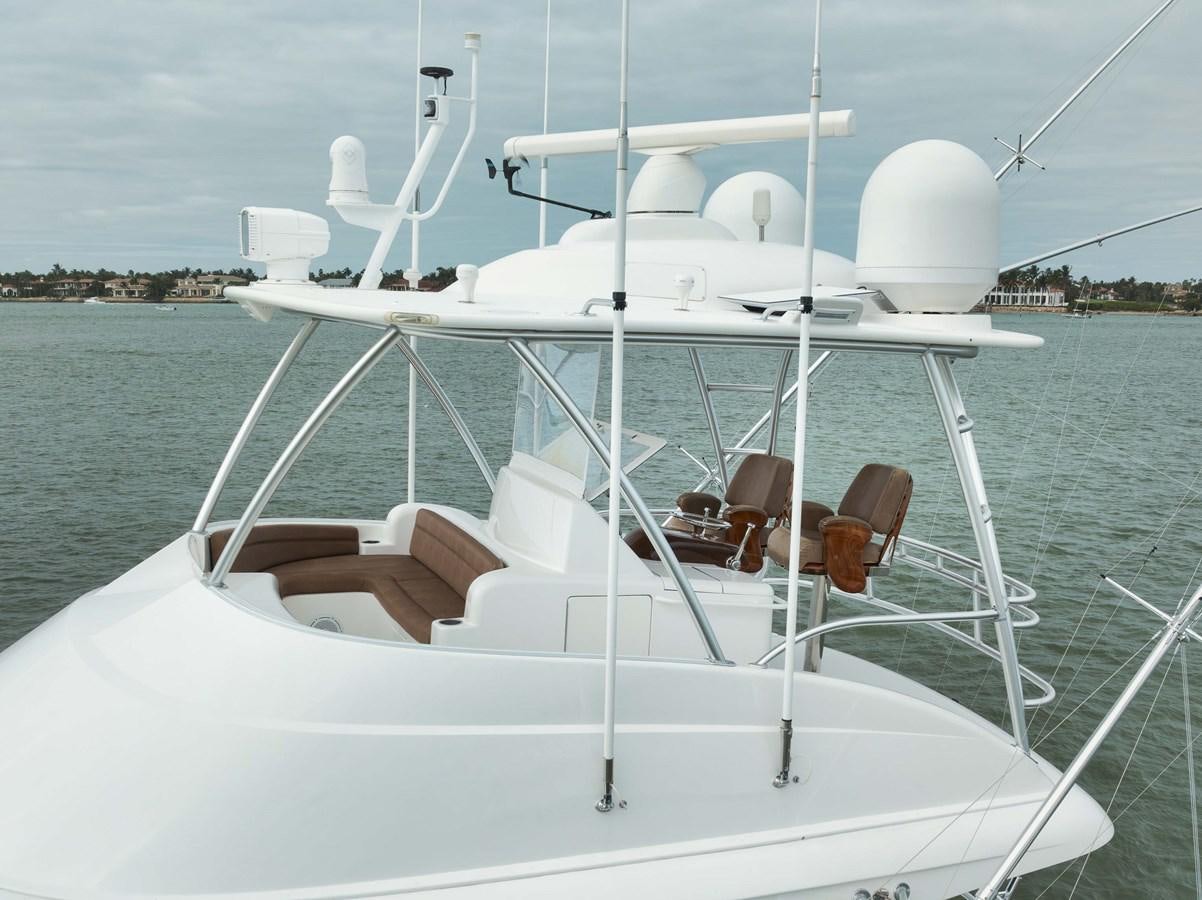 a white boat with white chairs on it aboard COOKIE MONSTER Yacht for Sale