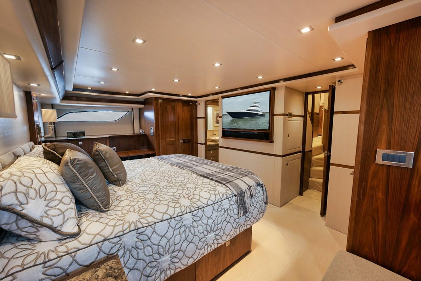 a bedroom with a bed and a television aboard COOKIE MONSTER Yacht for Sale