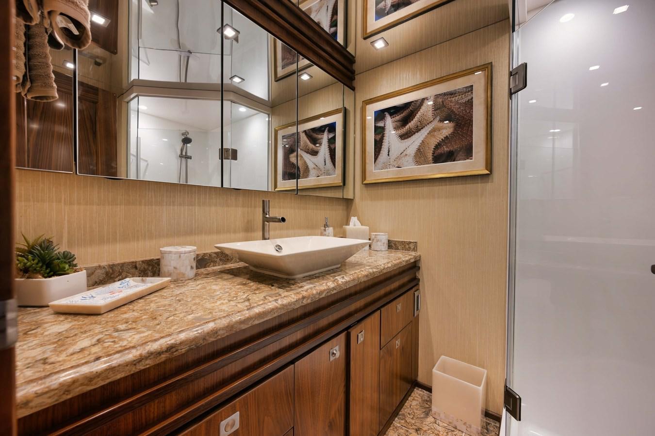 a bathroom with a countertop sink and mirror aboard COOKIE MONSTER Yacht for Sale