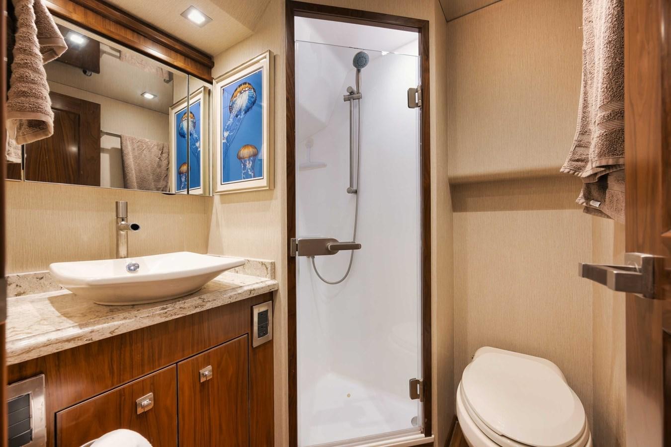 a bathroom with a shower and sink aboard COOKIE MONSTER Yacht for Sale