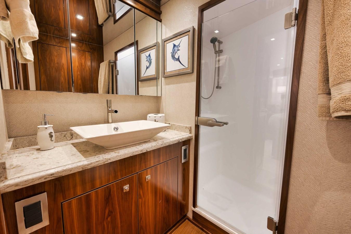 a bathroom with a shower and sink aboard COOKIE MONSTER Yacht for Sale