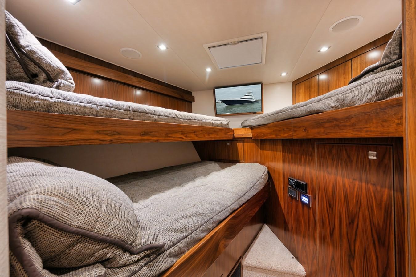 a bed with a wood headboard aboard COOKIE MONSTER Yacht for Sale