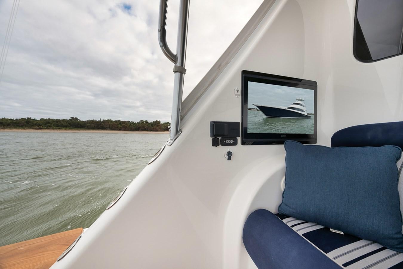 a boat with a flat screen television on the front aboard COOKIE MONSTER Yacht for Sale