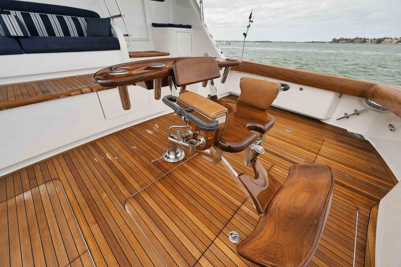 a deck with a chair and a table on it aboard COOKIE MONSTER Yacht for Sale