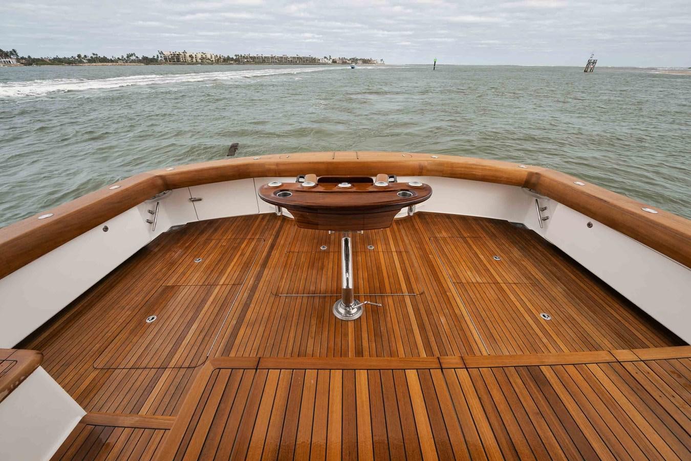 a wood deck with a grill on it by the water aboard COOKIE MONSTER Yacht for Sale