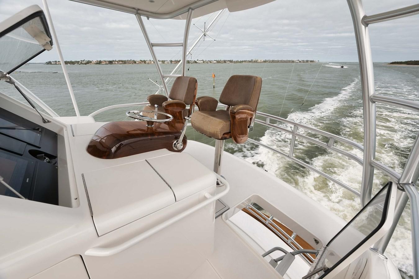 a boat with a seat on the front aboard COOKIE MONSTER Yacht for Sale