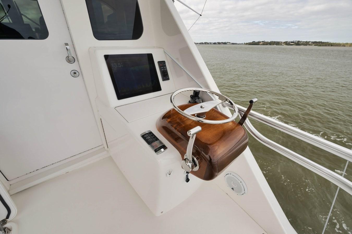 a boat with a steering wheel aboard COOKIE MONSTER Yacht for Sale