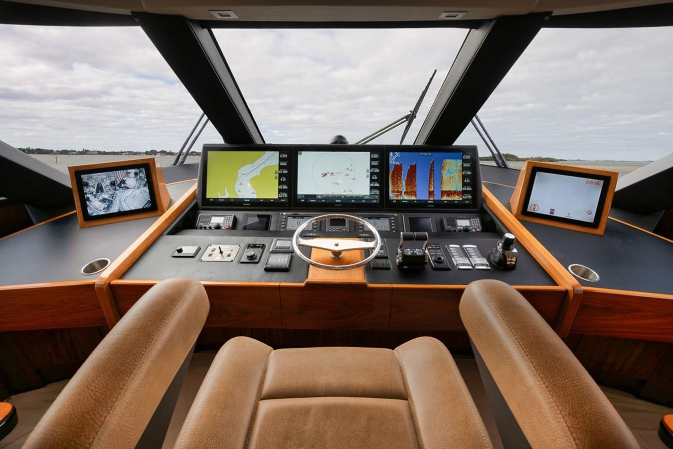 a control room with several monitors aboard COOKIE MONSTER Yacht for Sale