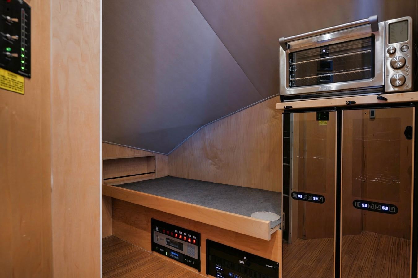 a microwave oven sits on top of a counter aboard COOKIE MONSTER Yacht for Sale