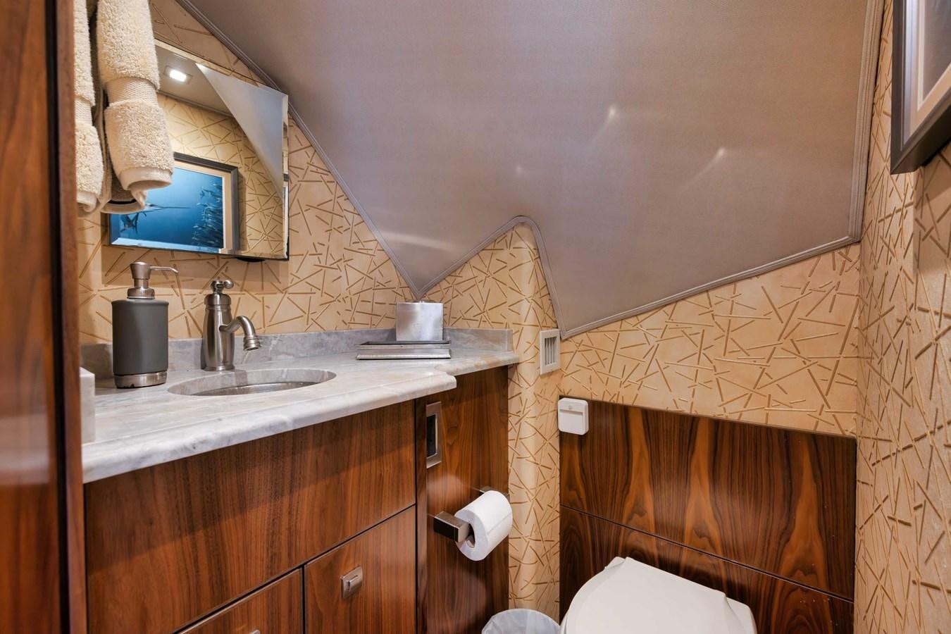 a bathroom with a sink and a mirror aboard COOKIE MONSTER Yacht for Sale