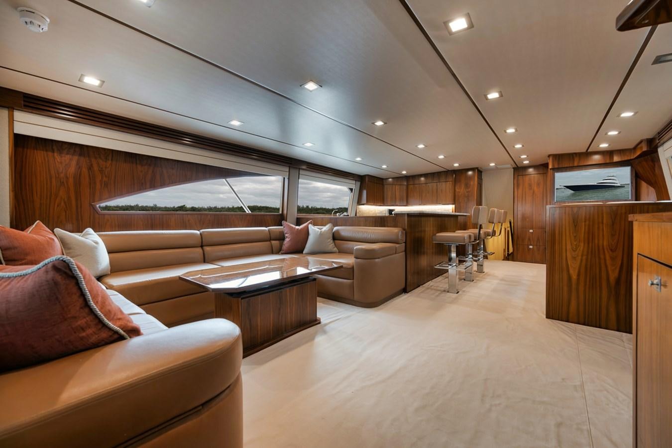 a living room with a large window aboard COOKIE MONSTER Yacht for Sale