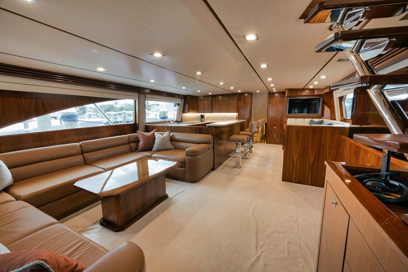 a living room with a couch and a table aboard COOKIE MONSTER Yacht for Sale