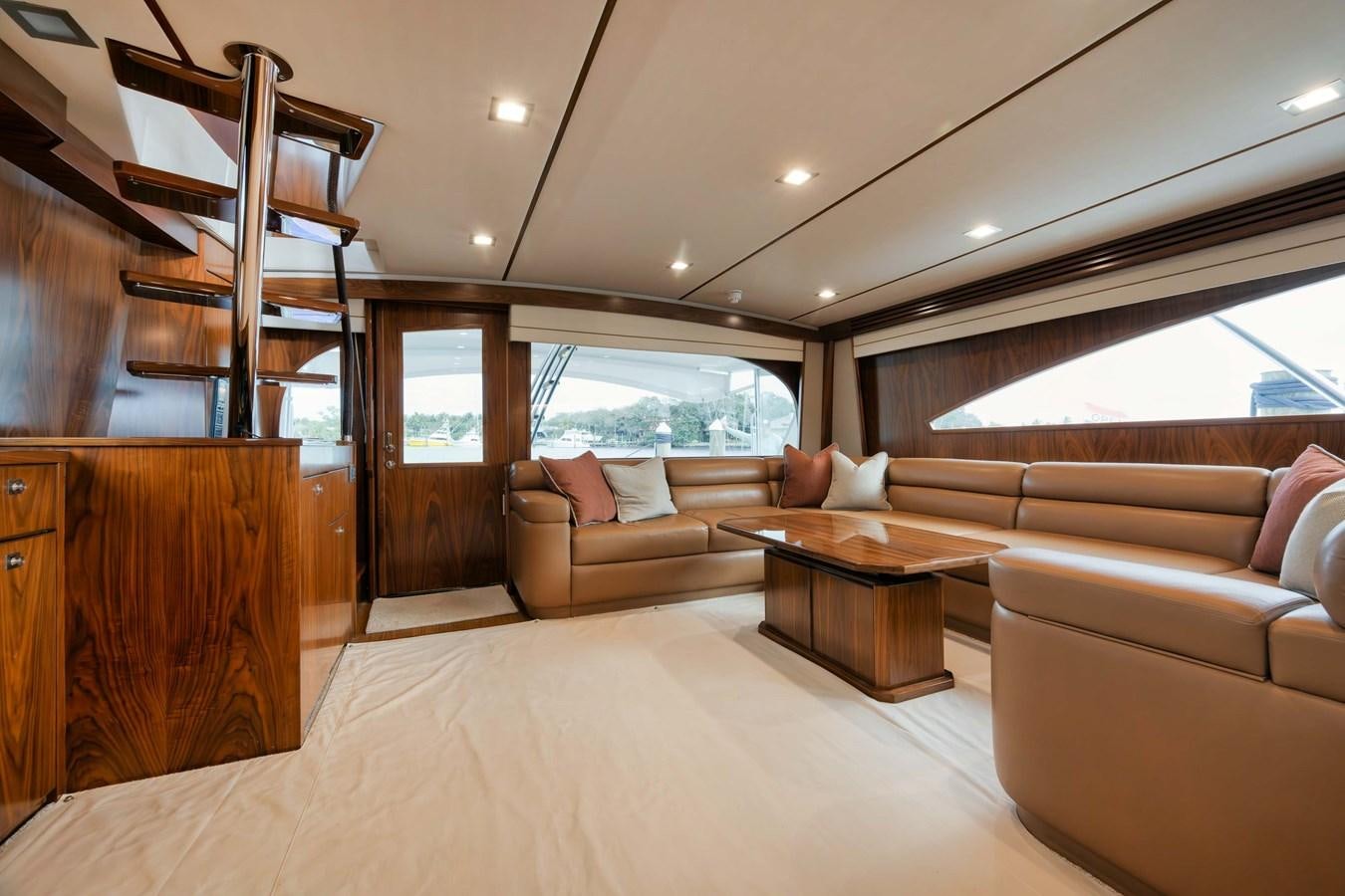 a living room with a large window aboard COOKIE MONSTER Yacht for Sale