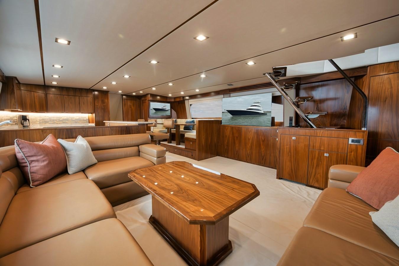 a living room with a wood table aboard COOKIE MONSTER Yacht for Sale