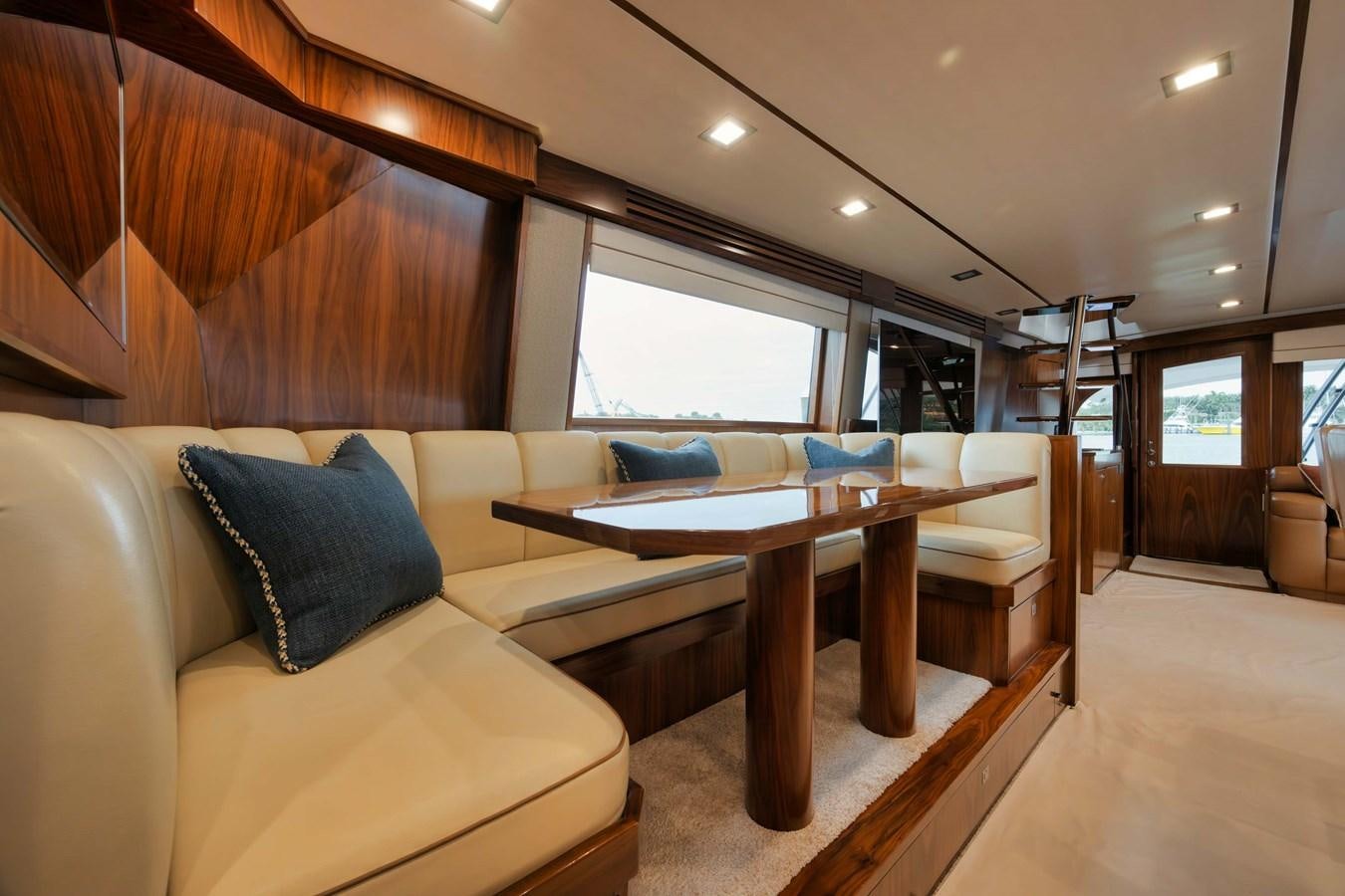 a living room with a couch and a table aboard COOKIE MONSTER Yacht for Sale