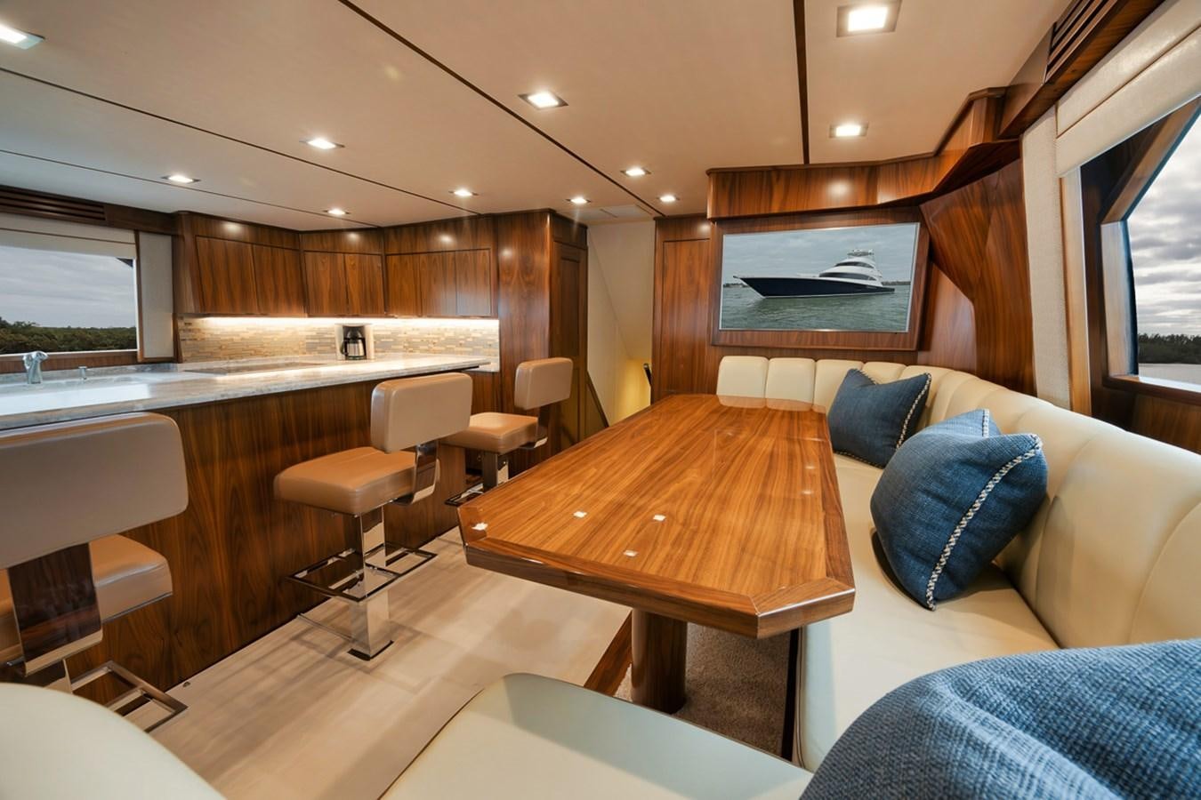 a room with a couch and a table aboard COOKIE MONSTER Yacht for Sale