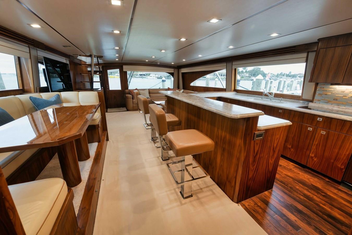 a room with tables and chairs aboard COOKIE MONSTER Yacht for Sale