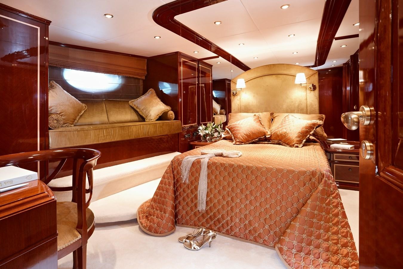 a bedroom with a bed and a couch aboard IRAKLIS L Yacht for Sale
