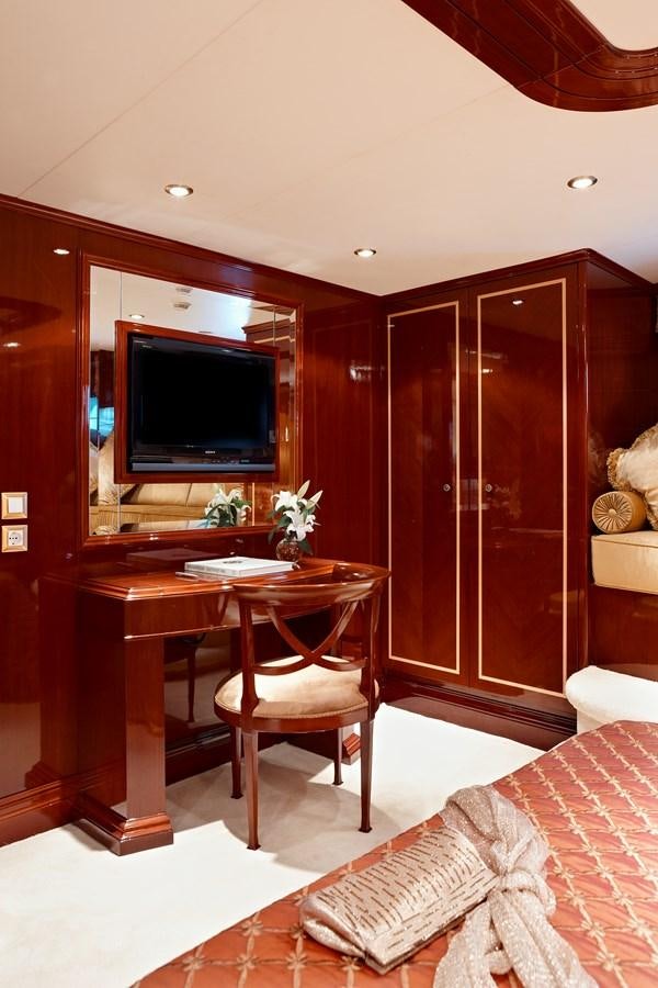 a room with a table and tv aboard IRAKLIS L Yacht for Sale