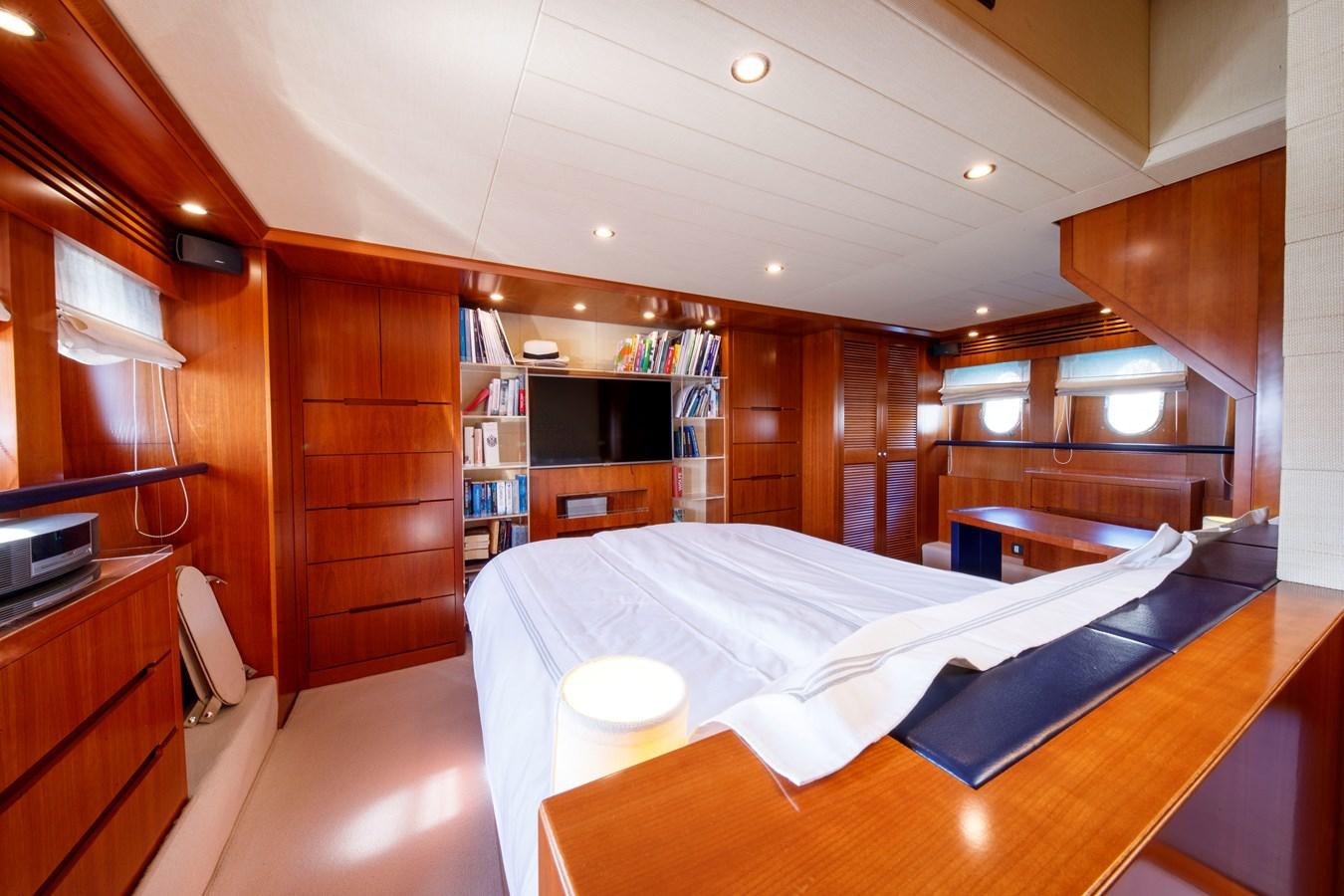 a room with a bed and a desk aboard TRUE AUSTRIAN Yacht for Sale