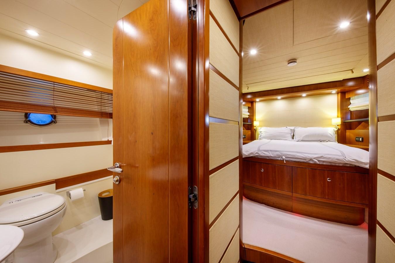 a bathroom with a wood door aboard TRUE AUSTRIAN Yacht for Sale