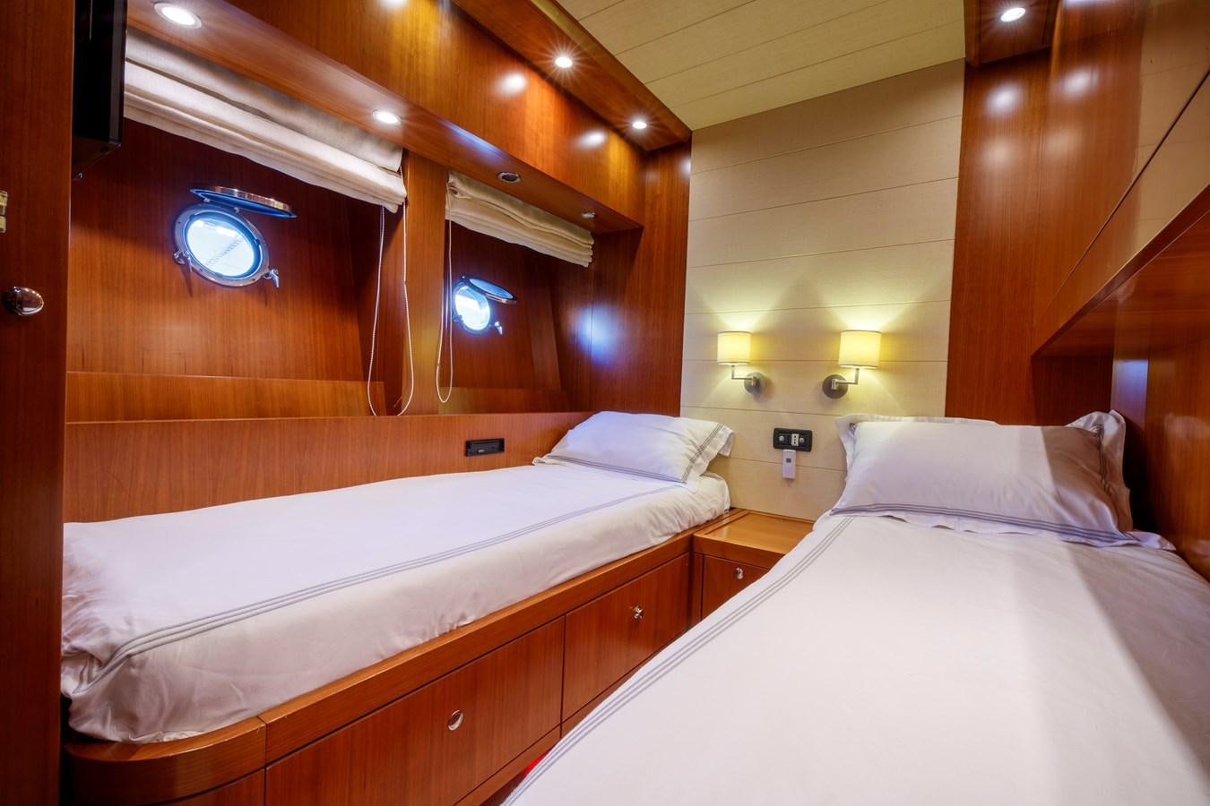 a room with two beds aboard TRUE AUSTRIAN Yacht for Sale