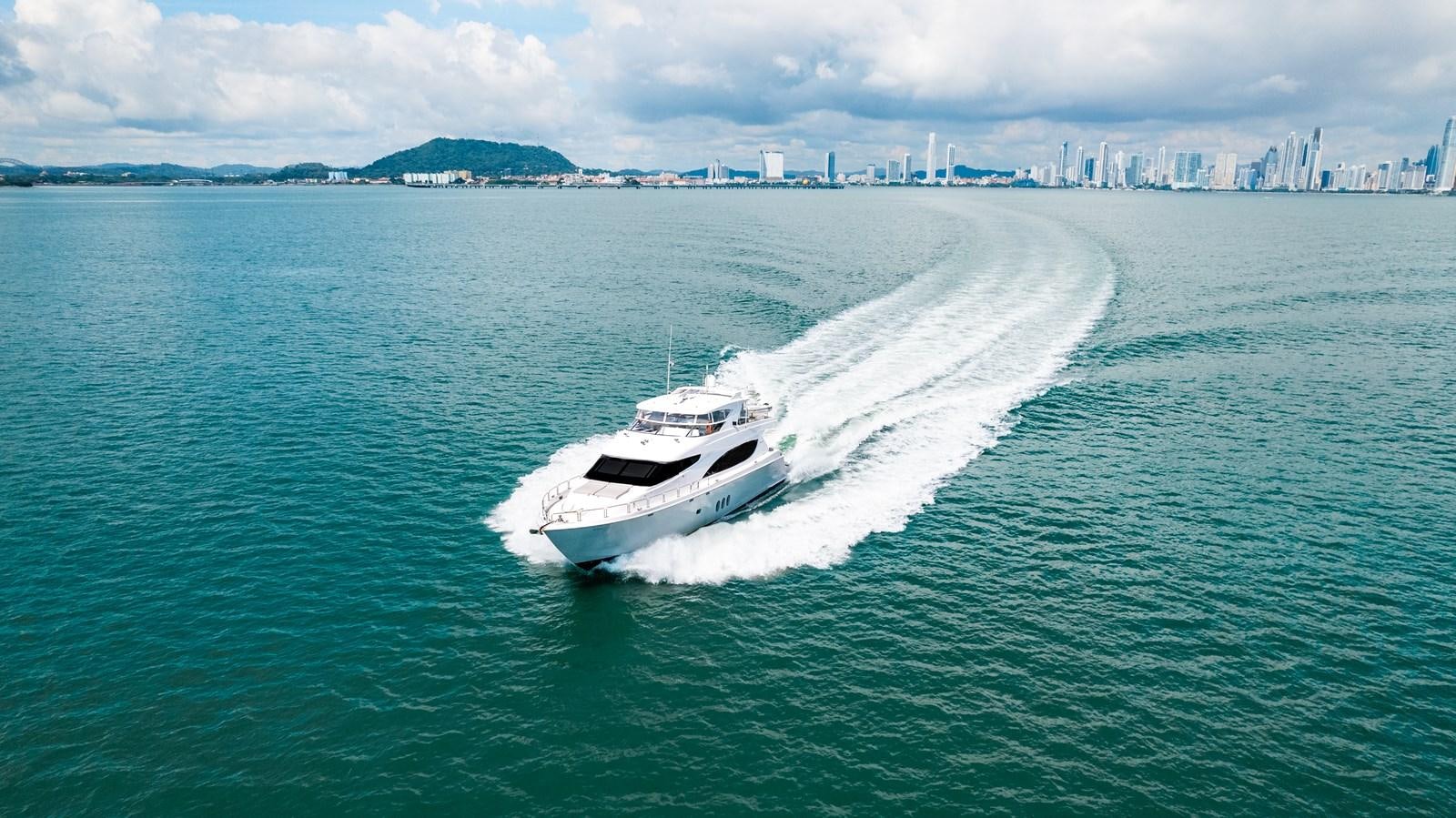 a boat on the water aboard HATTERAS 105 Yacht for Sale