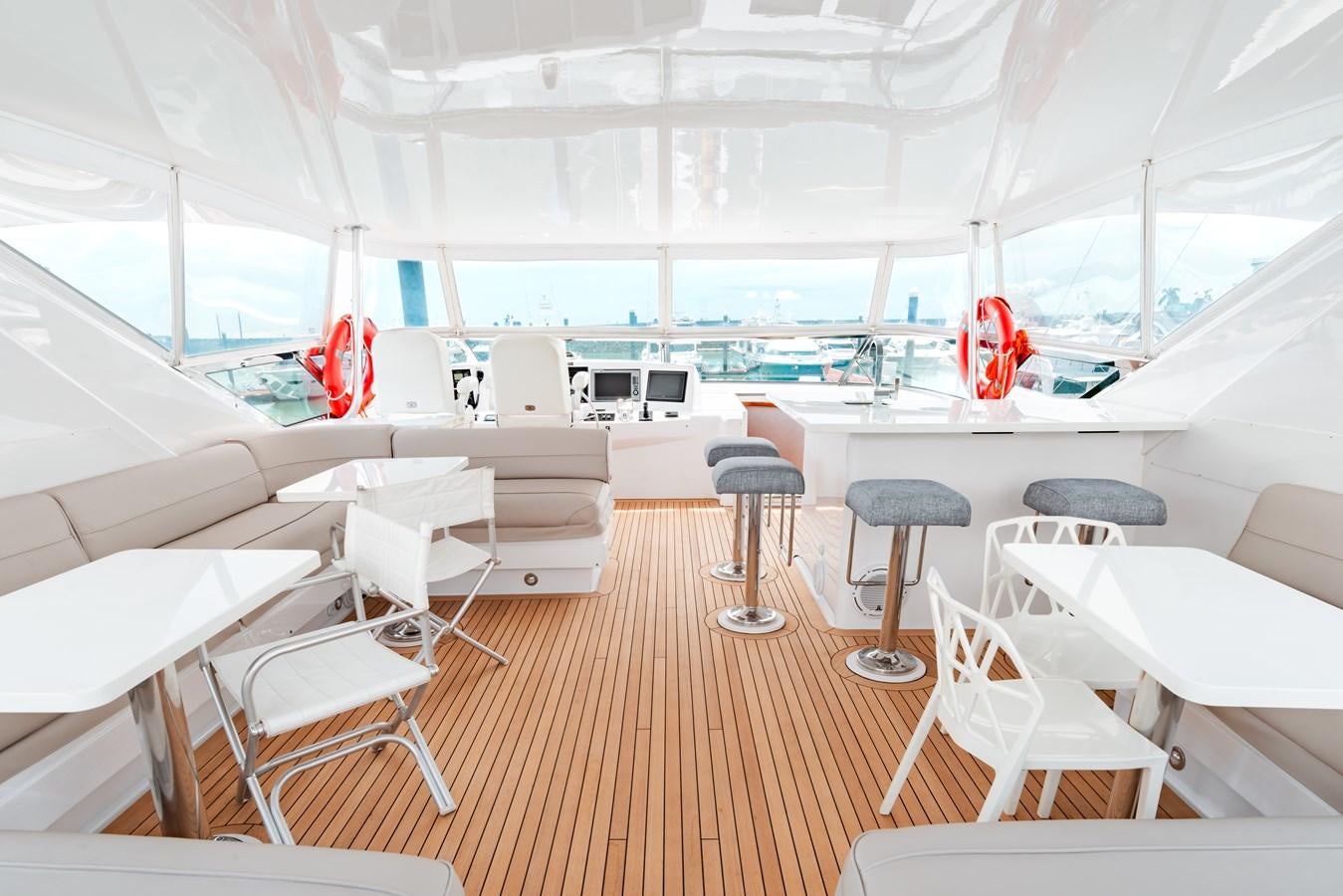 inside of a white tent aboard HATTERAS 105 Yacht for Sale