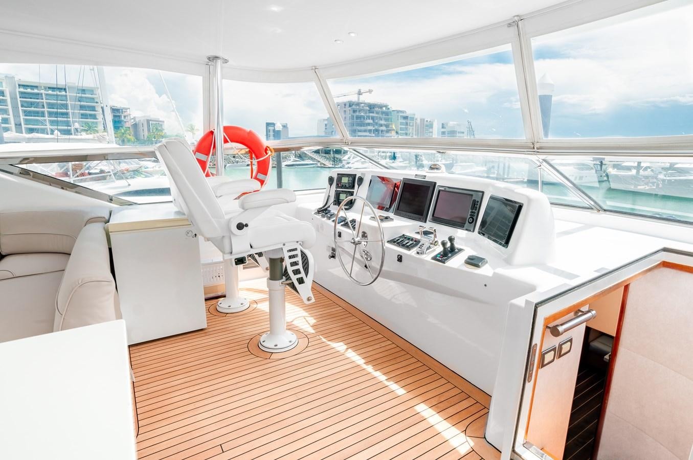 inside of a car aboard HATTERAS 105 Yacht for Sale