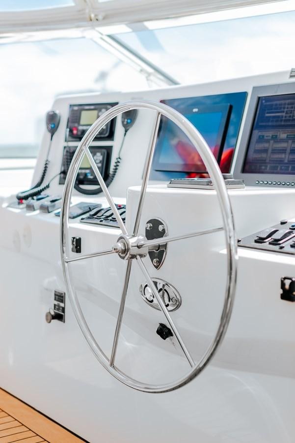 a white machine with a screen aboard HATTERAS 105 Yacht for Sale