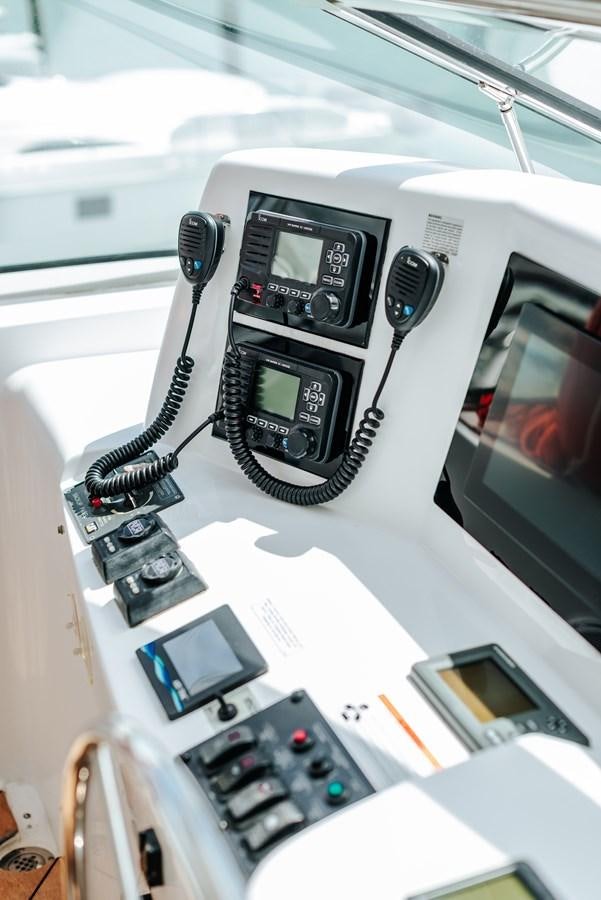 a car with a phone and a keyboard aboard HATTERAS 105 Yacht for Sale