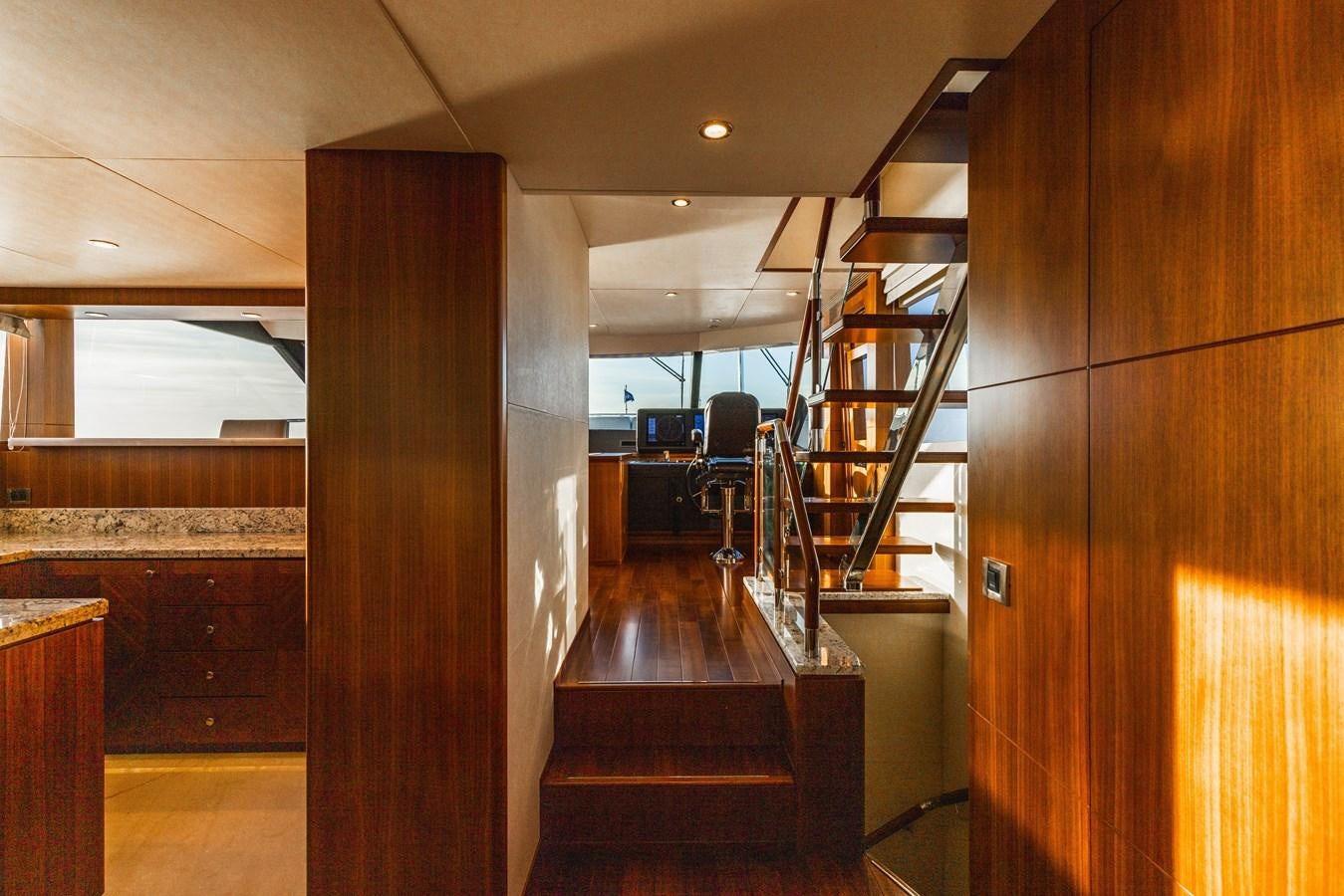 a room with wooden floors and a staircase aboard SEE WORTHY Yacht for Sale