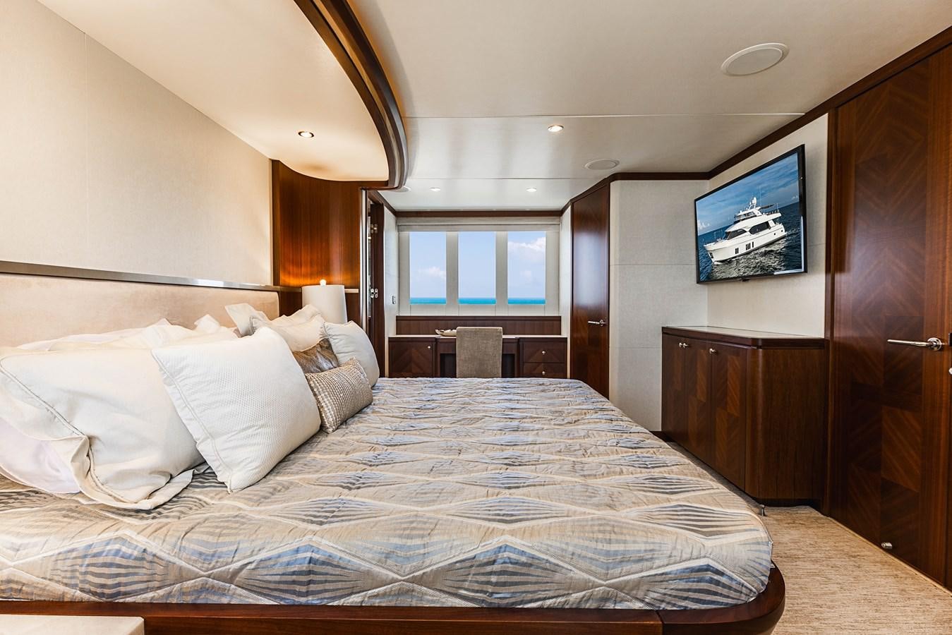 a bed with a television on the wall aboard SEE WORTHY Yacht for Sale